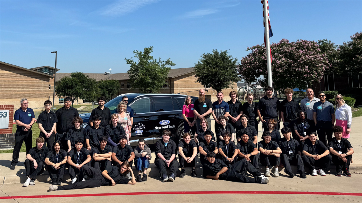  TECC East students and staff pose with Sam Pack Five Star Ford of Lewisville for vehicle donation. 
